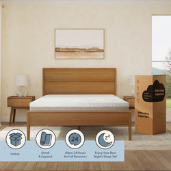 Wooden bed frame with a modern mattress in a cozy bedroom setting, featuring a natural wood nightstand and decorative artwork, promoting comfort and relaxation.