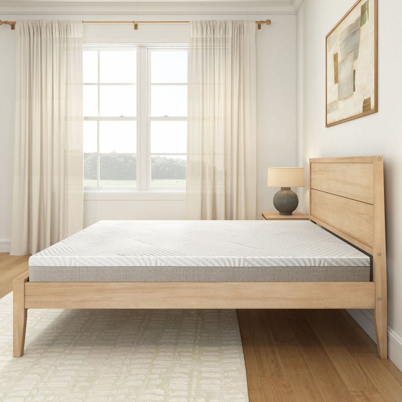 Modern minimalist bedroom with wooden bed frame and comfortable mattress.