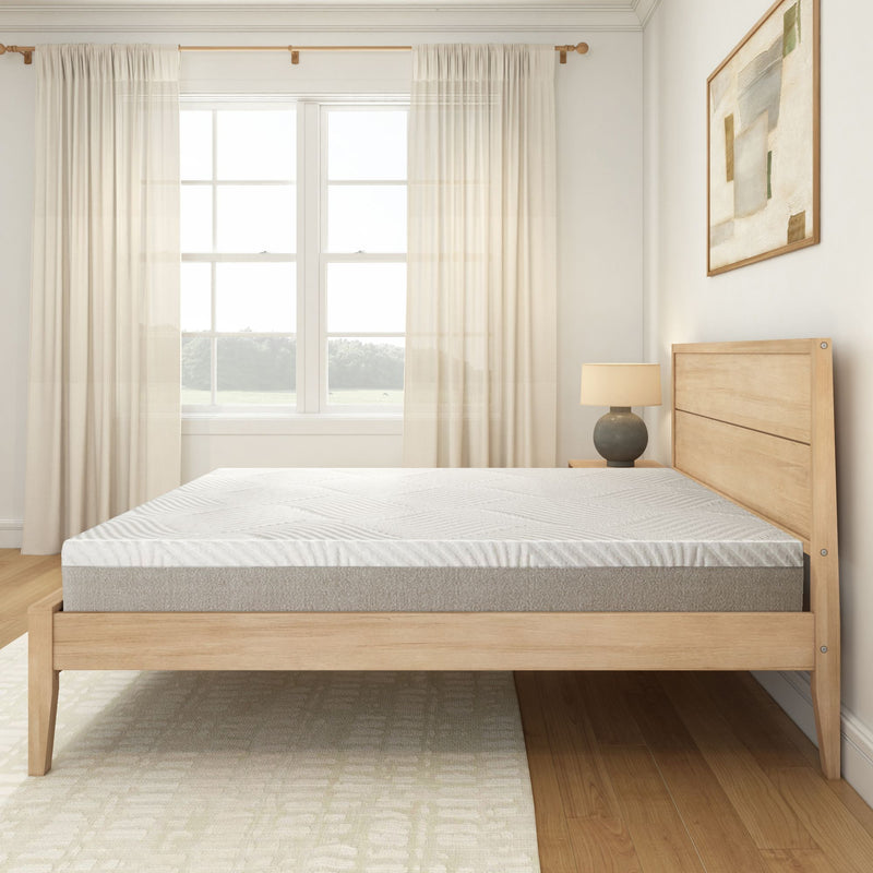 Modern wooden bed frame with a comfortable mattress in a bright, minimalist bedroom with natural light.