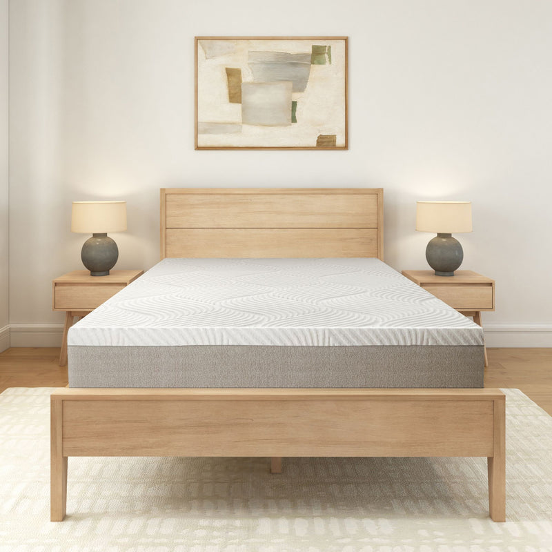 Wooden bed frame with modern gray mattress and abstract wall art in minimalist bedroom.