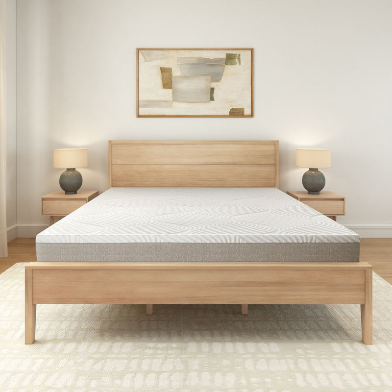 Wooden bed frame with modern mattress in minimalistic bedroom design.