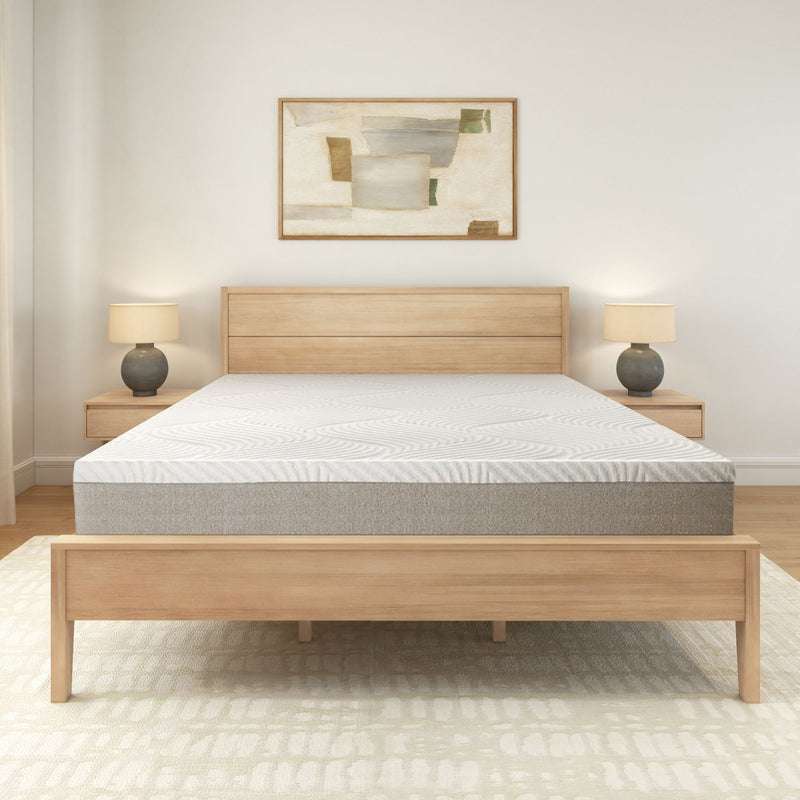 Modern bedroom with wooden bed frame, comfortable mattress, and stylish nightstands featuring matching lamps.