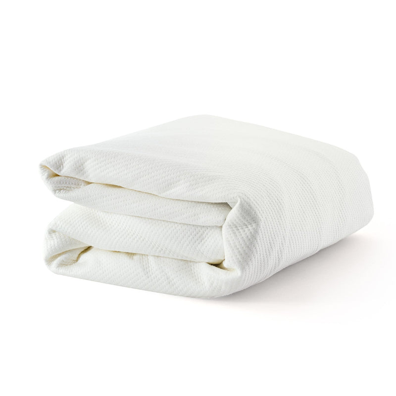 Folded white cotton bed sheet for luxury bedroom comfort and decor.