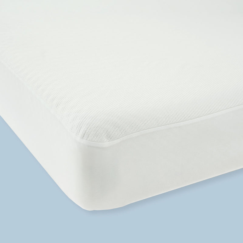 High-quality white mattress protector on blue background, offering superior comfort and protection for your bed.