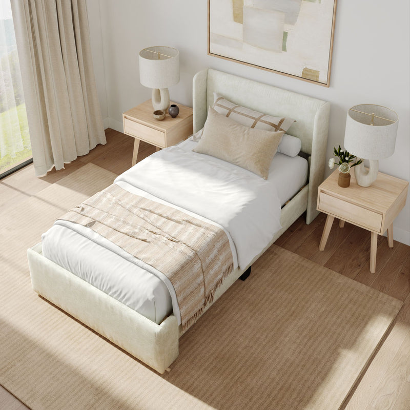 Contemporary bedroom with beige upholstered bed, wooden nightstands, modern lamps, and neutral decor.