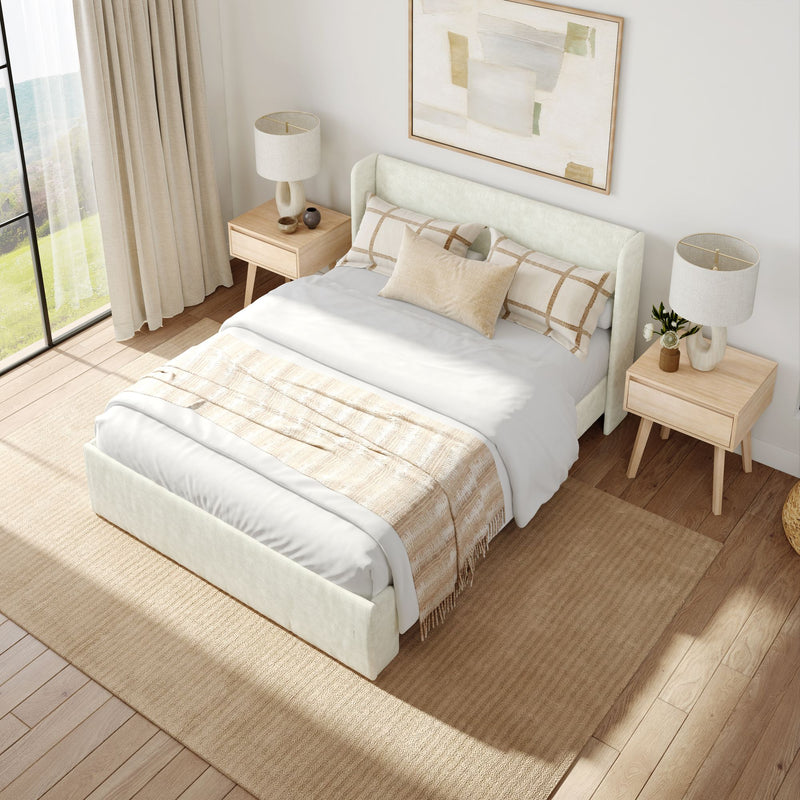 Modern minimalist bedroom with neutral colors and a cozy bed featuring beige and white bedding, complemented by wooden nightstands and contemporary lamps.