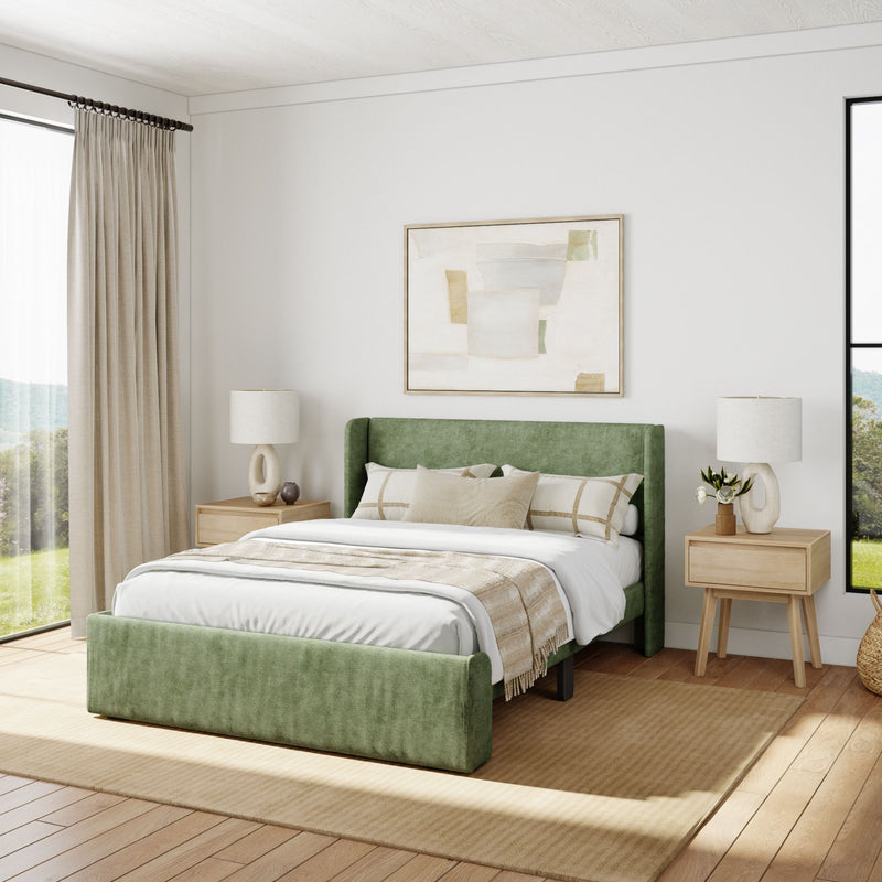 Modern bedroom with green upholstered bed, neutral decor, and natural light.
