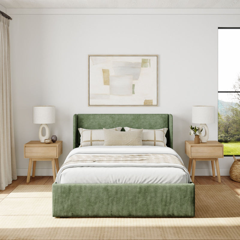 Elegant bedroom interior with a green upholstered bed, wooden nightstands, modern lamps, and abstract wall art.
