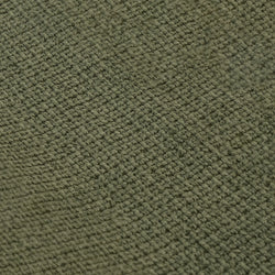 Close-up of green woven fabric texture for textile design and upholstery background.