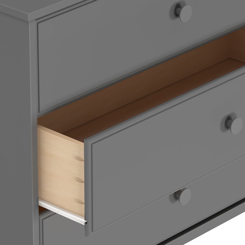Gray modern dresser with open wooden drawer showcasing storage solutions.