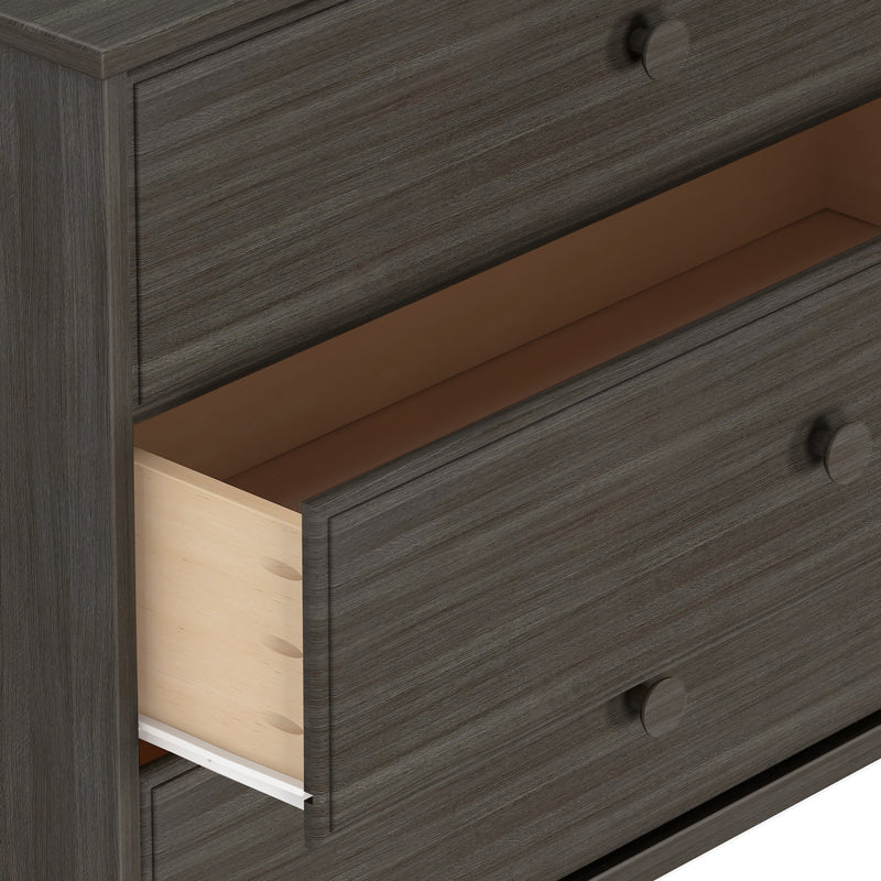 Dark wood dresser with three open drawers showing interior, modern storage furniture.