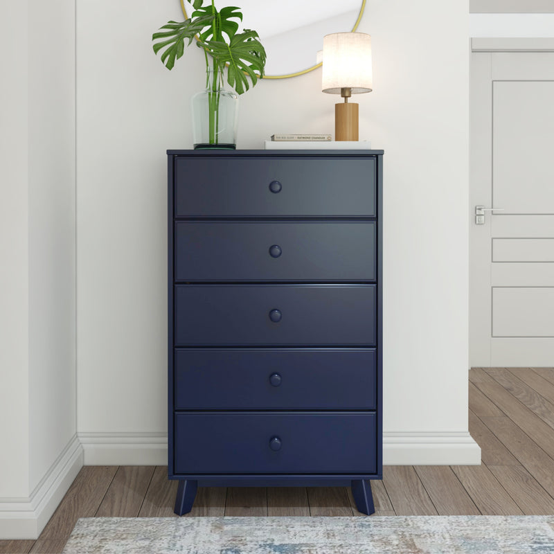 Blue five-drawer dresser with lamp and plant, bedroom decor.