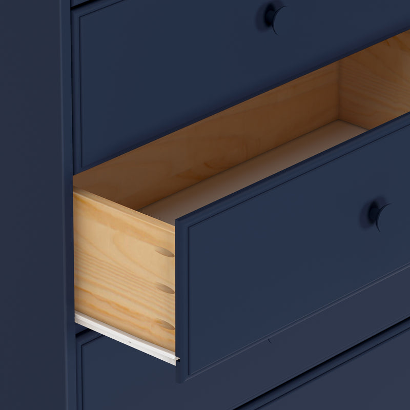 Close-up of a navy blue wooden dresser with an open drawer showcasing interior wood finish.
