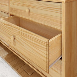 Wooden dresser with an open drawer, showcasing natural wood grain texture and ample storage space.