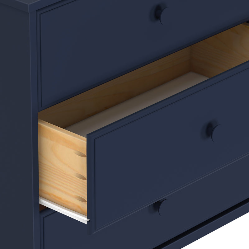 Blue wooden chest of drawers with open middle drawer showcasing natural wood interior.