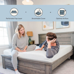 Couple testing a breathable mattress with perforated top layer and breathable cover for optimal airflow on a white quilted mattress with a grey wooden bed frame in a modern bedroom.