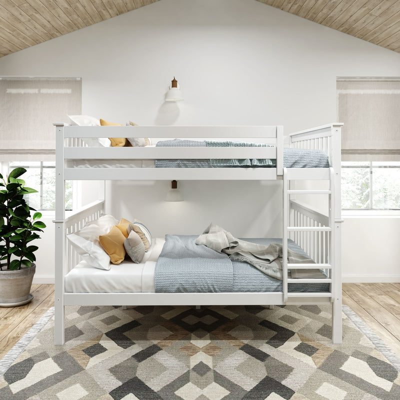 White wooden bunk bed in a bright bedroom with modern decor and patterned rug.