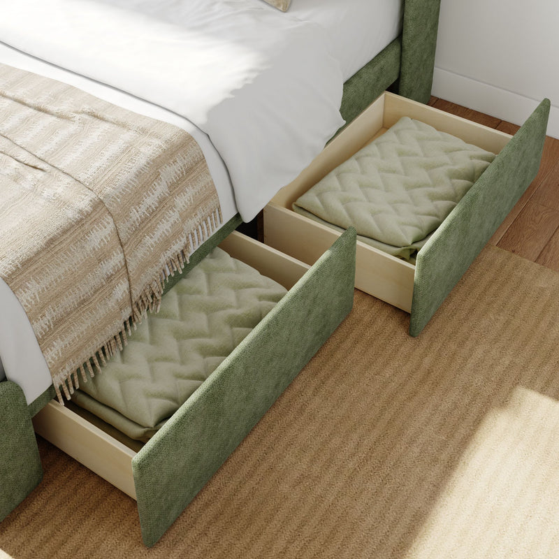 Under-bed storage drawers with green upholstery, featuring cozy blankets, in a modern bedroom setting.