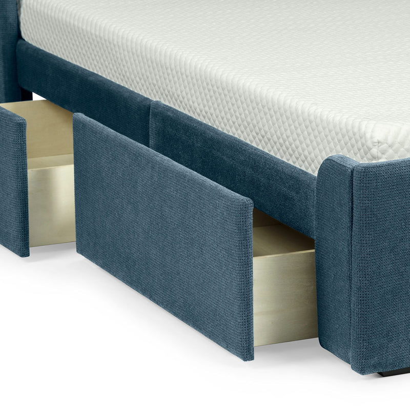 Luxurious upholstered bed with built-in storage drawers and comfortable mattress.