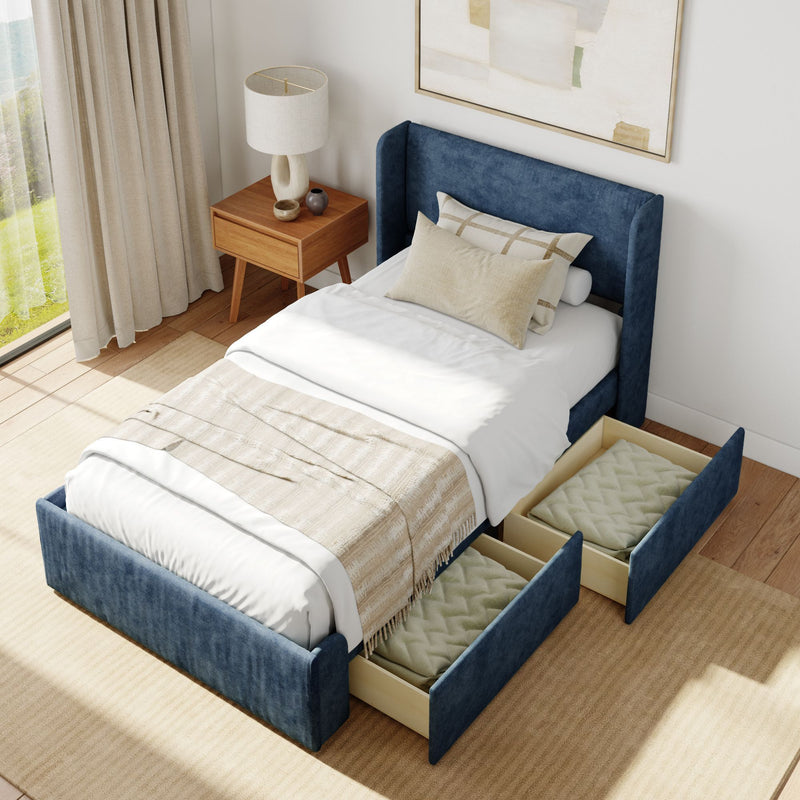 Elegant modern bedroom with blue upholstered bed featuring built-in storage drawers, wooden side table, and neutral decor.