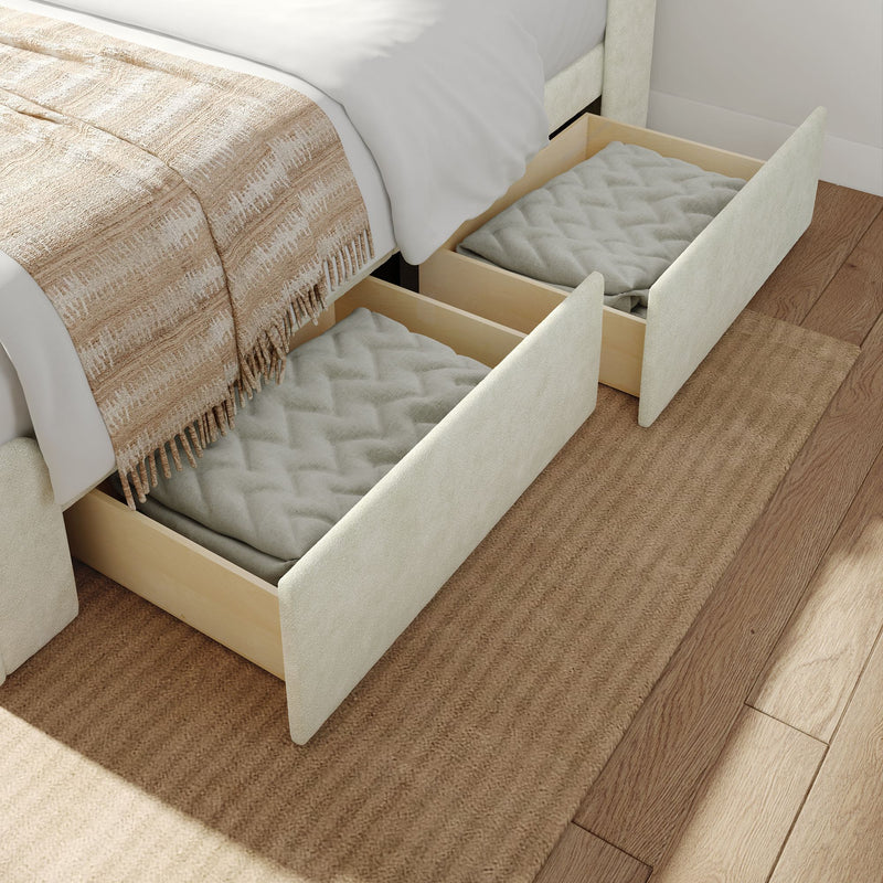 Underbed storage drawers with blankets on wooden floor.