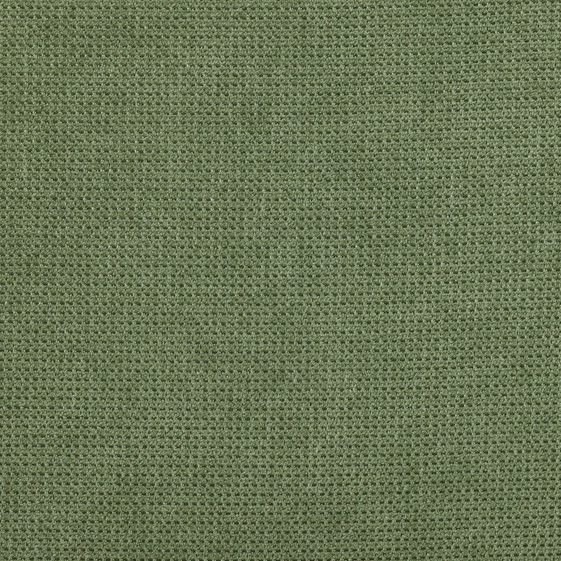 Green textured fabric background with waffle weave pattern.