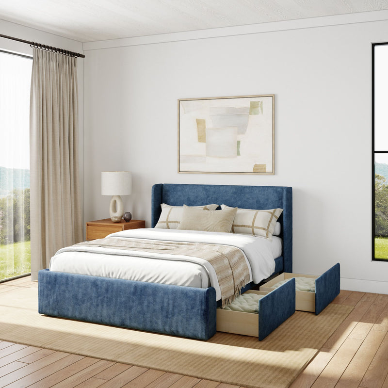 Luxurious modern bedroom with a stylish blue upholstered bed featuring built-in storage drawers, beige bedding, wooden side table, and abstract wall art.