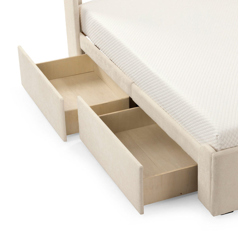 Beige upholstered platform bed with two built-in wooden under-bed storage drawers and white quilted mattress — space-saving bedroom storage solution