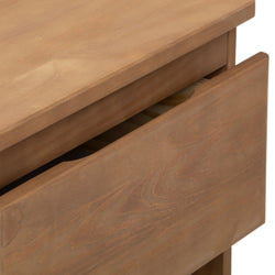 Wooden chest of drawers with open drawer showing natural grain texture.