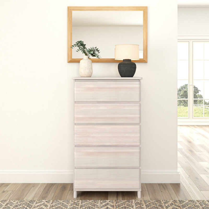 Minimalist bedroom interior with white dresser, mirror, plants, and lamp for modern home decor.