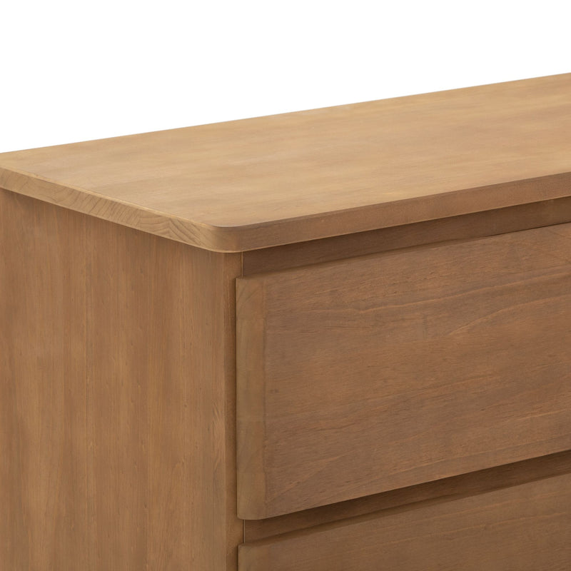 Modern wooden dresser with sleek design and natural finish.