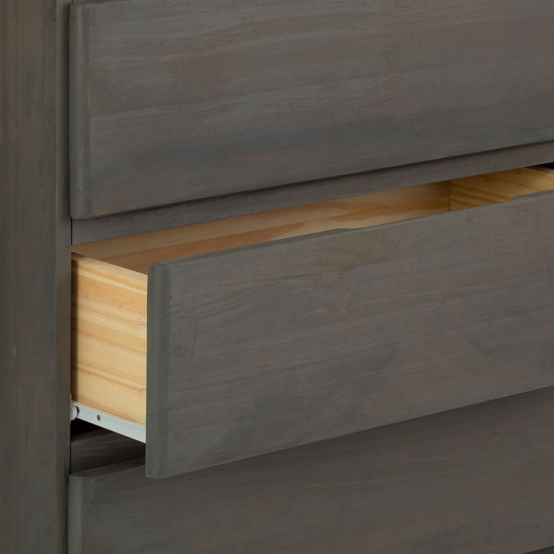 Open wooden dresser drawer revealing light wood interior.