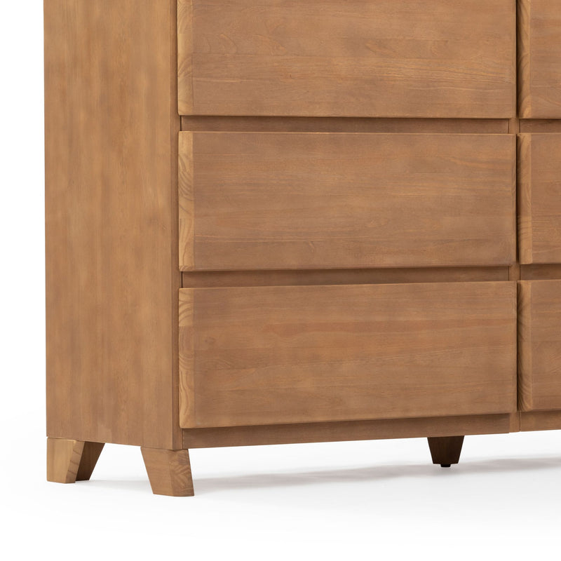 Modern wooden dresser with natural finish and minimalist design featuring three large drawers.
