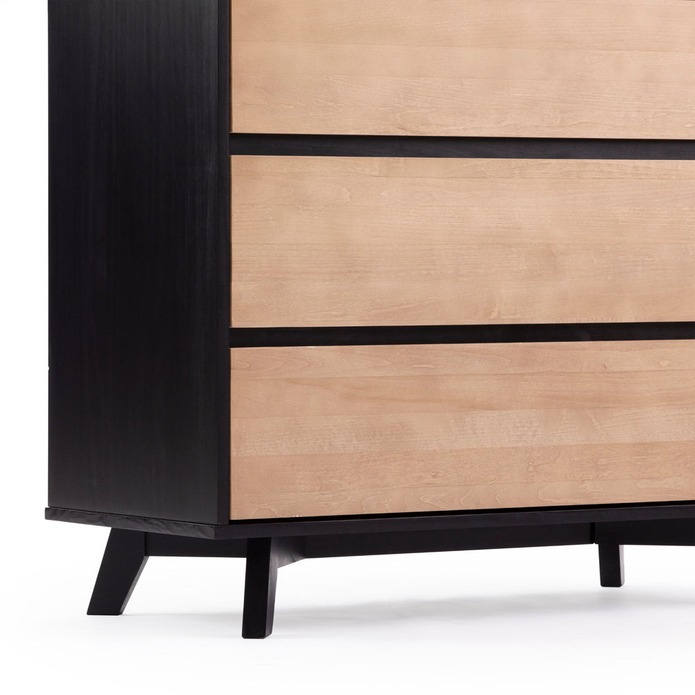 Modern black and natural wood dresser with sleek mid-century design.