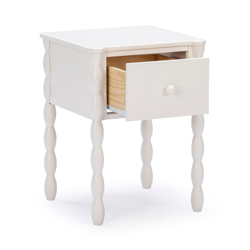 White wooden bedside table with turned spindle legs and single pull-out drawer, farmhouse-style nightstand with storage