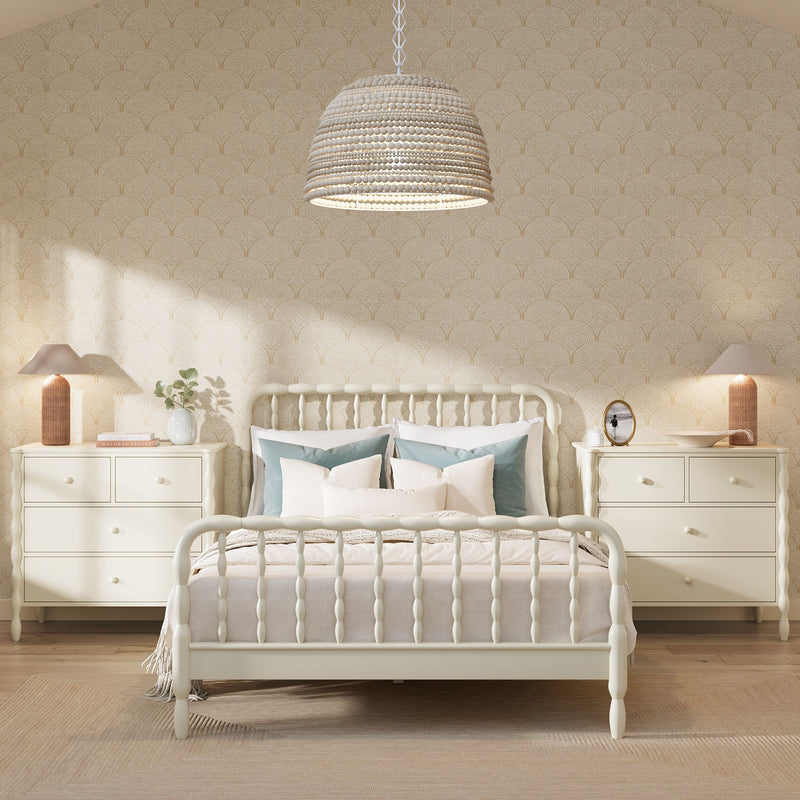 Neutral farmhouse bedroom with cream spindle bed, woven pendant light, matching bedside dressers, teal accent pillows, textured wallpaper and natural light