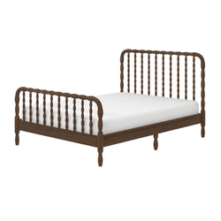Dark walnut wooden spindle bed frame with white mattress, turned spindles and low platform for modern farmhouse bedroom