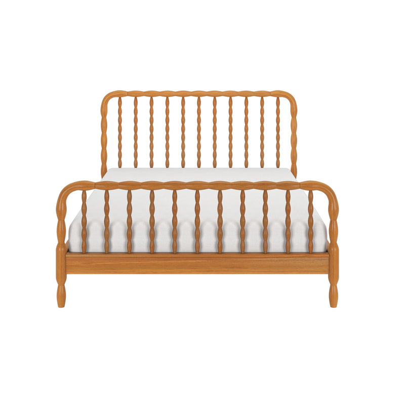 Front view of light oak wooden spindle bed frame with turned headboard and footboard and white mattress — farmhouse-style bedroom furniture
