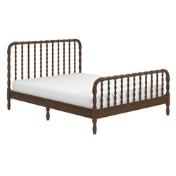 Walnut wooden spindle bed frame with white mattress — farmhouse-style platform bed with turned legs, headboard and footboard