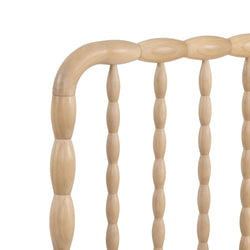 Close-up of light natural wood spindle chair back with turned spindles and curved top rail on white background