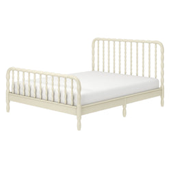 Cream-painted wooden spindle bed frame with turned spindles and low platform base, farmhouse vintage-style bed with white mattress