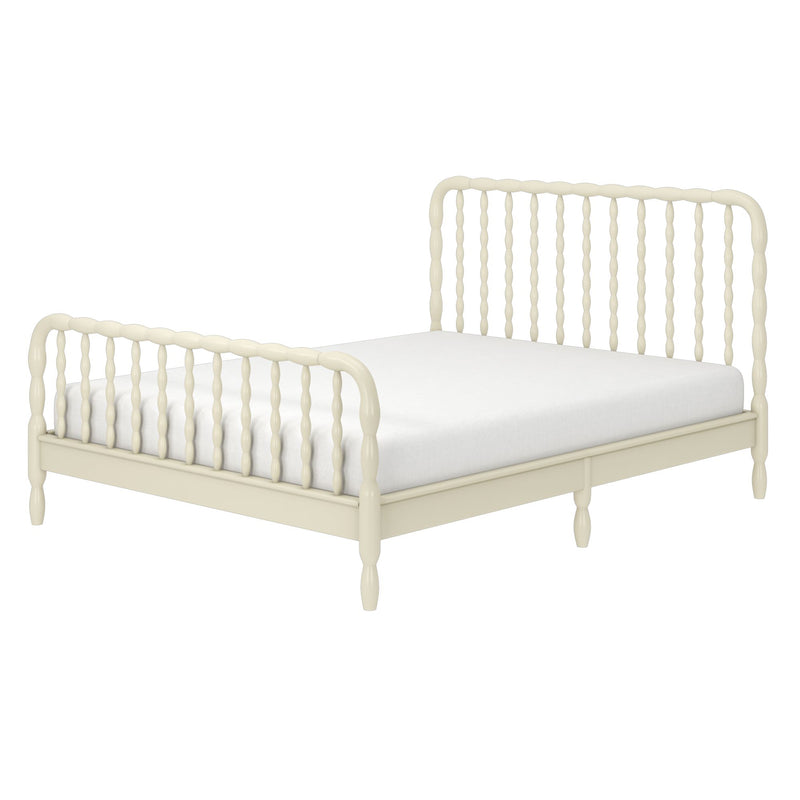 Cream-painted wooden spindle bed frame with turned spindles and low platform base, farmhouse vintage-style bed with white mattress