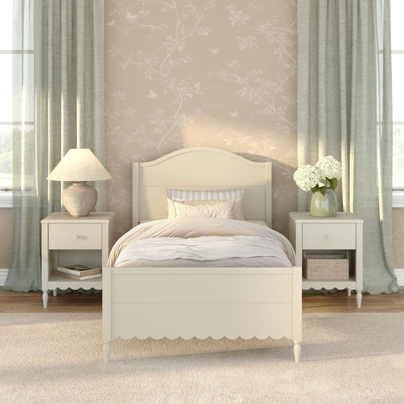 Cozy cream wooden bedroom with matching nightstands, ceramic table lamp, hydrangea vase, soft floral wallpaper and pale green curtains