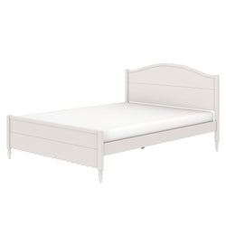 White wooden bed frame with curved headboard, scalloped footboard and turned legs with mattress, cottage-style
