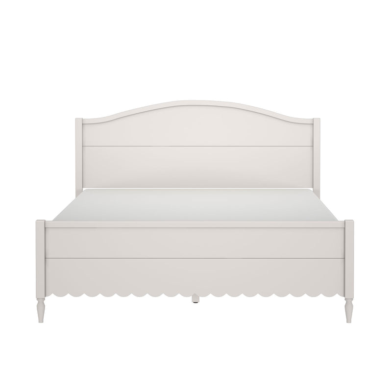 White wooden farmhouse bed frame with curved headboard, scalloped footboard and turned legs