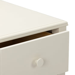 Close-up of cream white wooden dresser with slightly open drawer, round knob and smooth top edge, modern minimalist bedroom storage furniture
