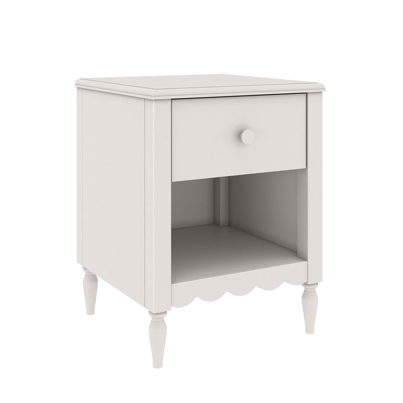 White wooden bedside table nightstand with single drawer, open lower shelf, turned legs and scalloped apron in farmhouse style