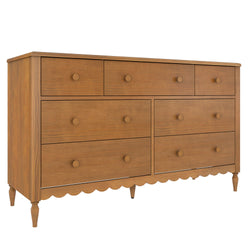 Mid-century modern 7-drawer wooden dresser in honey oak finish with round knobs, scalloped apron and turned legs for bedroom storage