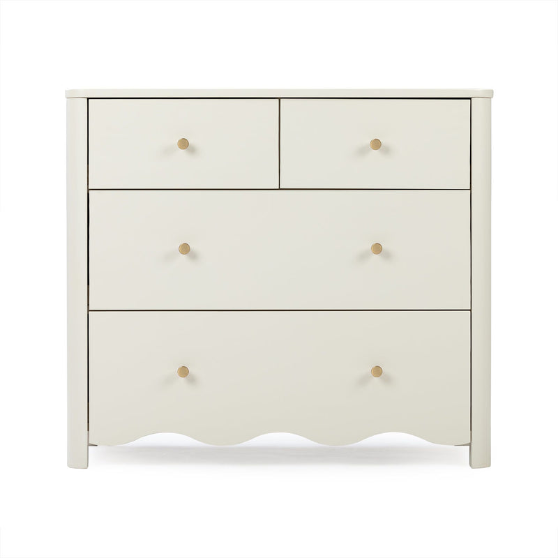 Cream four-drawer wooden dresser with round brass knobs and scalloped base for bedroom storage