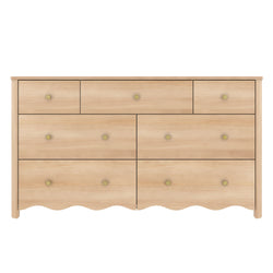 Light natural wood dresser with multiple drawers, round brass knobs and scalloped base — modern farmhouse bedroom storage